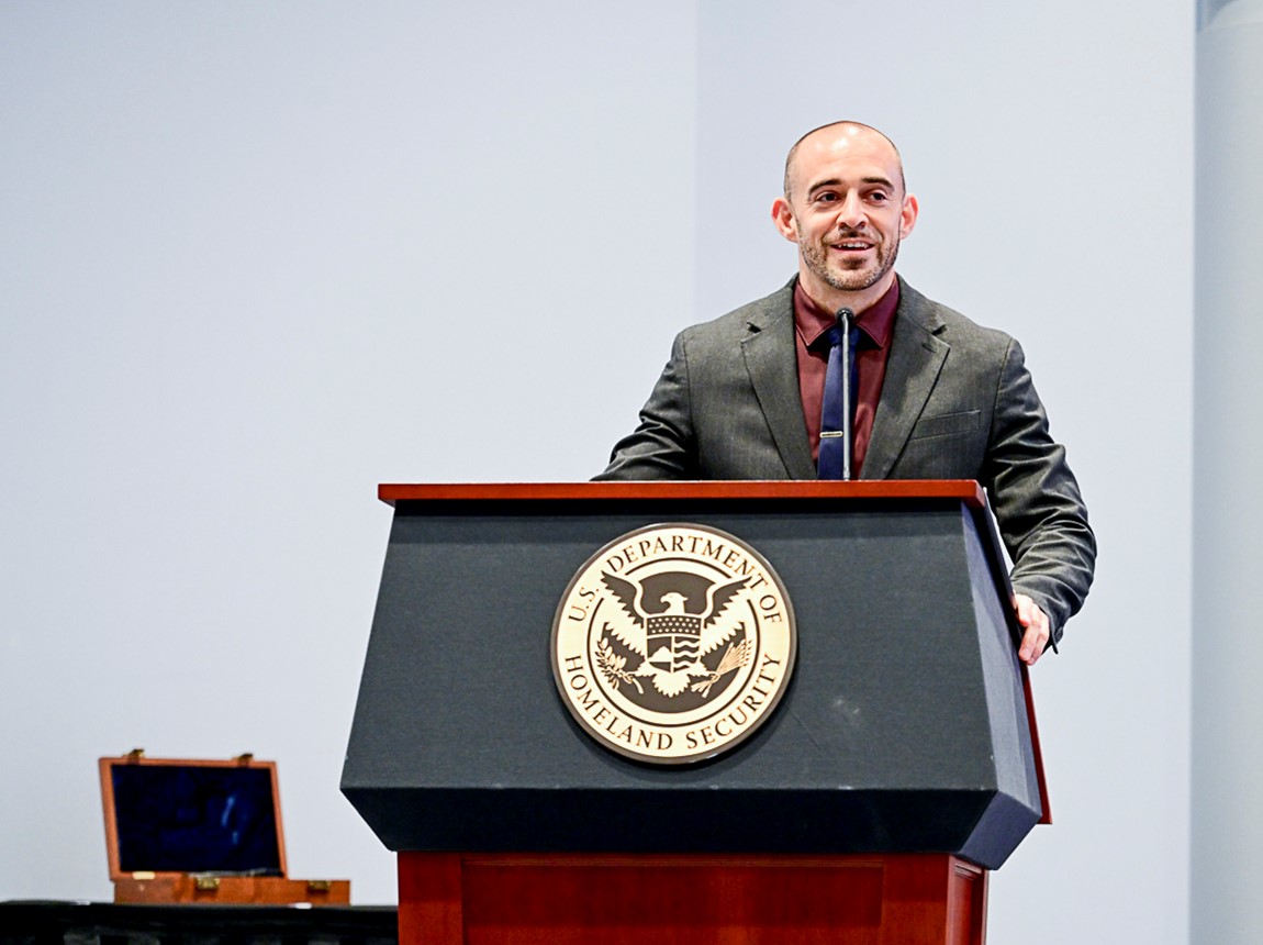 Honor Graduate Award recipient, Special Agent Christopher Whitehurst delivers award speech during the Honor Graduate of the Year Ceremony, in Glynco, Ga., May 29, 2025. (FLETC OPA/David Tucker)