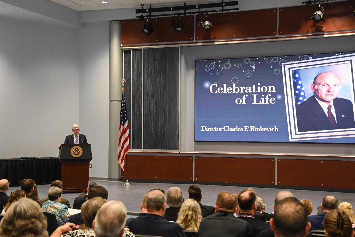 Former Director Ralph Basham delivered welcoming remarks at the Celebration of Life Ceremony for Former Director Charles F. Rinkevich, June 4, 2025, Glynco GA. (Photo by David Tucker/OPA)