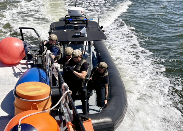 Students performing an underway vessel boarding on the Cooper River