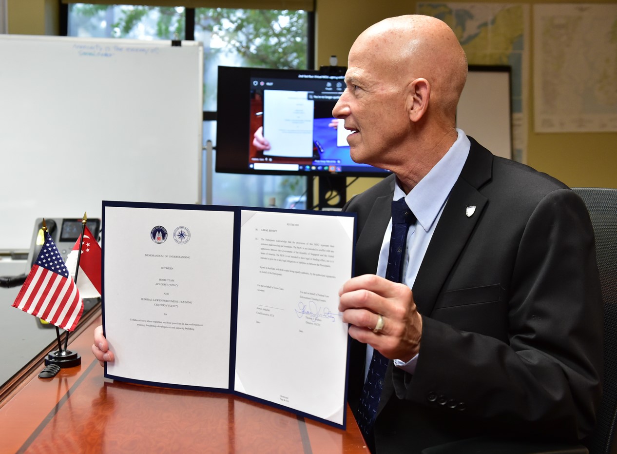 On September 20, 2022, Thomas J. Walters, Director of the Federal Law Enforcement Training Centers (FLETC), signed a new Memorandum of Understanding with Anwar Abdullah, Chief Executive of Singapore's Home Team Academy (HTA), to continue collaborating as training partners in professional exchanges. (Photo by David Tucker/FLETC/OPA)