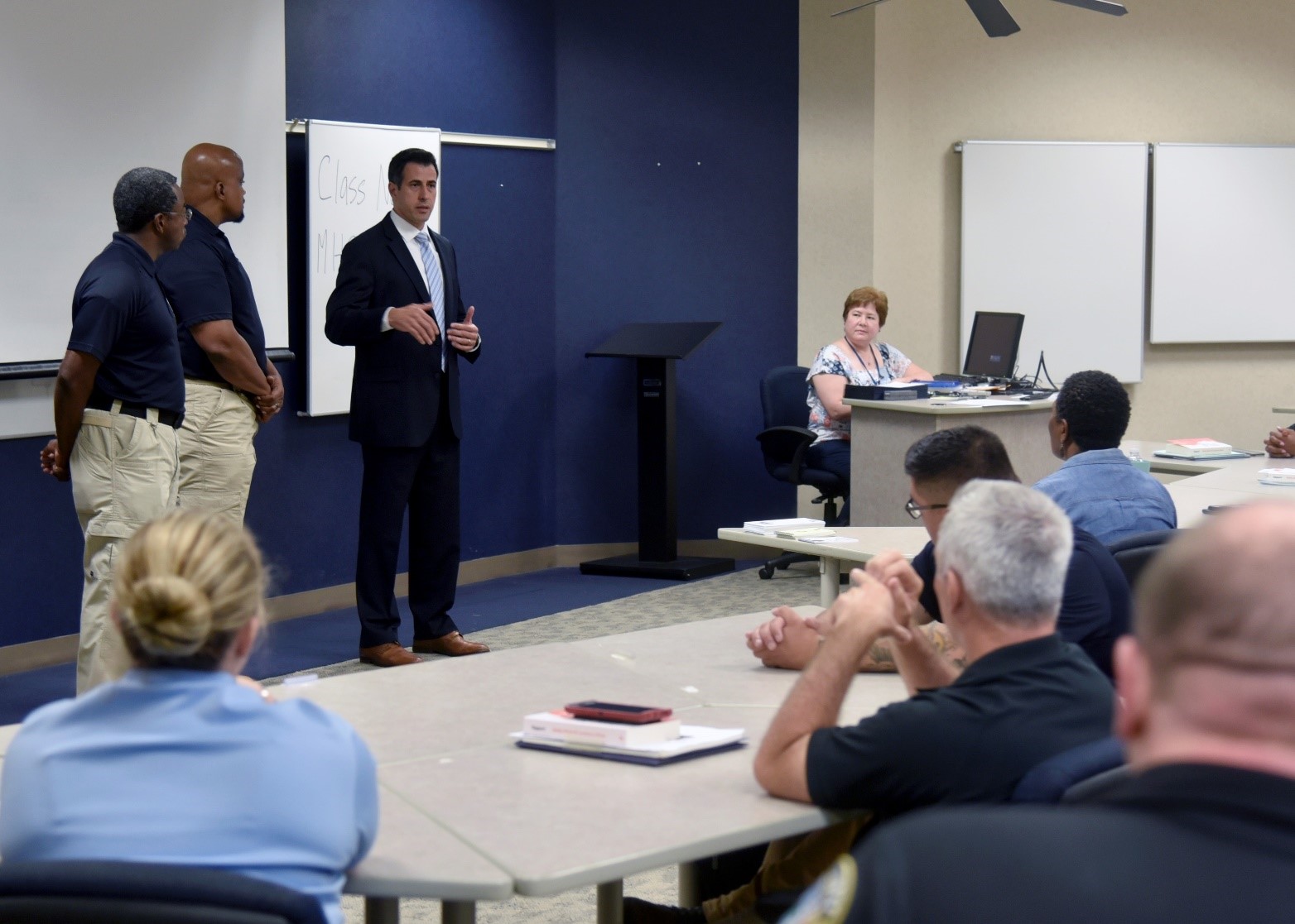 FLETC Assistant Director Kai Munshi addresses the Mental Health Crisis Instructor Training Program students attending the inaugural course held at FLETC-Glynco, Aug 22 – 25, 2022.  (Photo by Brandon Spragins, OPA)