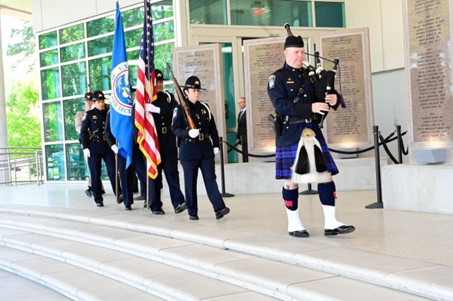Office of Field Operations Customs and Border Protection Honor Guard march by the FLETC Graduates Memorial. (Photo by David Tucker, FLETC/OPA)