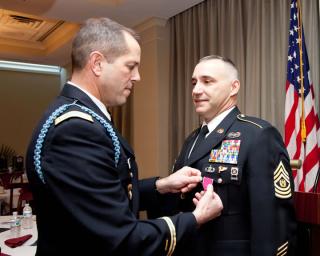 Instructor Glenn Guy received the Legion of Merit award during a military award ceremony at the FLETC. Instructor Glenn Guy received the Legion of Merit award during a military award ceremony at the FLETC.